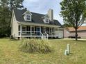 Inviting two-story home featuring a cozy front porch and an attached garage at 717 Papsworth Ct, Fuquay Varina, NC 27526