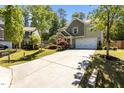 Well-maintained home with a spacious driveway and beautiful landscaping, nestled in a serene neighborhood at 8840 Forester Ln, Apex, NC 27539