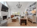 Bright living room with vaulted ceilings, a fireplace, and stylish decor at 1112 Watauga Street St, Raleigh, NC 27604