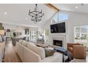 Open-concept living room with fireplace, hardwood floors, and abundant natural light at 1112 Watauga Street St, Raleigh, NC 27604