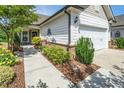 Well-maintained home showcasing manicured landscaping, a charming walkway, and an inviting entrance at 112 Manning Way, Durham, NC 27703