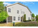 Spacious backyard featuring a screened in porch and a lawn with mature trees at 1175 Contessa Dr, Cary, NC 27513