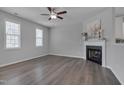 Bright living room featuring a fireplace, ceiling fan, and hardwood floors at 138 Yellow Jacket Rdg, Clayton, NC 27520