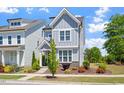 Charming two-story home featuring a welcoming front porch and beautifully landscaped yard at 1601 Glazebrook Dr, Wake Forest, NC 27587
