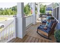 Cozy front porch featuring comfortable rocking chairs and a porch swing, creating a relaxing outdoor space at 201 Annabelle Blue Drive, Wake Forest, NC 27587