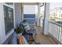 Inviting front porch featuring cozy seating, perfect for relaxing and enjoying the neighborhood views at 201 Annabelle Blue Drive, Wake Forest, NC 27587