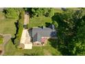 Overhead view of a brick home featuring a large yard and a long driveway at 2457 Millbrook Dr, Haw River, NC 27258