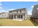 Backyard view showcasing a screened porch and outdoor patio at 2650 Turner Pines Dr, New Hill, NC 27562
