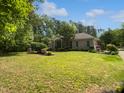 Spacious lawn and charming brick home with manicured landscaping at 280 Dreamcatcher Trl, Youngsville, NC 27596