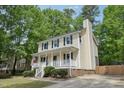 Lovely two-story home with a classic front porch and an extended driveway at 300 Hutchins Dr, Garner, NC 27529