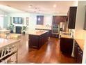 Spacious kitchen with granite countertops, stainless steel appliances, and hardwood floors at 3032 Curling Creek Dr, Apex, NC 27502