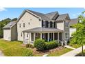 Charming two-story home with a welcoming front porch and well-maintained landscaping at 508 Vervain Way, Holly Springs, NC 27540