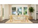 Bright dining room with wood floors, a large window, and a neutral color palette at 545 Morning Light Dr, Angier, NC 27501