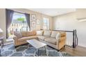 Comfortable living room with a large sectional sofa and bright natural light at 5504 Crabtree Park Ct, Raleigh, NC 27612