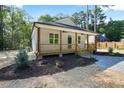 Charming one-story home with a covered front porch, manicured landscaping, and a well-maintained lawn at 604 Natchez Trace, Fuquay Varina, NC 27526