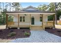 Inviting home with a covered front porch, ceiling fans, and freshly landscaped yard at 604 Natchez Trace, Fuquay Varina, NC 27526