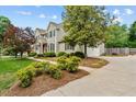 Beautifully landscaped home with a spacious driveway and well-maintained lawn at 608 Driftwood Dr, Gibsonville, NC 27249