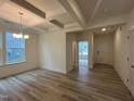 Well-lit dining area with hardwood floors and detailed coffered ceiling at 776 Old Station Pointe, Angier, NC 27501