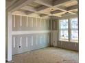 Spacious living room features a coffered ceiling and bright windows at 776 Old Station Pointe, Angier, NC 27501