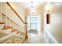 Condo building hallway with stairs and tiled floor at 8231 Allyns Landing Way # 302, Raleigh, NC 27615