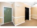 Hallway with an elevator and apartment doors at 8231 Allyns Landing Way # 302, Raleigh, NC 27615