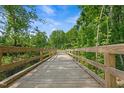 Scenic wooden bridge on the community walking trail provides a nature escape at 908 Kensley Grove Ln # 69, Fuquay Varina, NC 27526