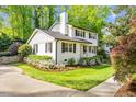 Beautiful two-story home with lovely landscaping, black shutters, and a well-maintained lawn at 1008 Winona Rd, Raleigh, NC 27609