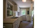 Bright kitchen featuring a double basin sink and plenty of natural light at 1015 Cross Link Rd, Raleigh, NC 27610