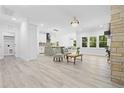 Spacious open-concept living area, seamlessly connects kitchen, fireplace, and dining, creating ideal entertaining space at 107 Seminole Dr, Louisburg, NC 27549