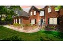 Charming red brick home featuring manicured landscaping and a walkway leading to the front entrance at 1258 Jamestowne Dr, Elon, NC 27244