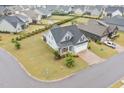 Beautiful aerial view of a home nestled in a well-maintained neighborhood with lush green lawns at 47 Scarlet Bell Dr, Youngsville, NC 27596