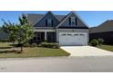 Classic two-story home featuring a spacious two-car garage and a well-maintained front lawn at 47 Scarlet Bell Dr, Youngsville, NC 27596