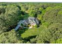 Stunning aerial view of a beautiful home nestled among lush green trees and a well-manicured lawn at 503 Belmont Cir, Wake Forest, NC 27587