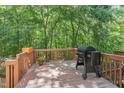 Cozy wooden deck perfect for outdoor dining and relaxing with lush green backdrop at 5420 Vista View Ct, Raleigh, NC 27612