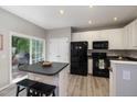 Modern kitchen with stainless steel appliances, an island, and plenty of cabinet space at 5420 Vista View Ct, Raleigh, NC 27612