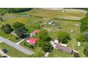 Aerial view of homes with red roofs surrounded by verdant trees and landscaping offering beautiful neighborhood scenery at 5423 Nc-39, Selma, NC 27576