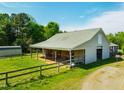 Spacious barn and fenced-in pasture offer ample space for livestock or agricultural pursuits at 5916&5918 Laws Farm Rd, Rougemont, NC 27572