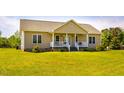 Charming one-story home with a welcoming front porch, manicured lawn and tasteful exterior at 5916&5918 Laws Farm Rd, Rougemont, NC 27572