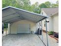 Spacious metal carport and shed perfect for vehicle storage and other equipment at 67 Bull Run N, Timberlake, NC 27583