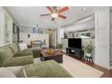Spacious living room with hardwood floors and a plush sectional sofa for comfortable living at 7200 Rabbit Run, Wake Forest, NC 27587
