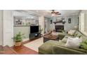 A cozy living room with a fireplace, hardwood floors, and an open layout at 7200 Rabbit Run, Wake Forest, NC 27587