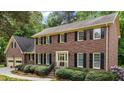Charming brick home featuring black shutters, well-kept landscaping, and a welcoming front entrance at 804 Warwick Ct, Burlington, NC 27215