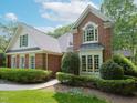 Brick house featuring detailed brickwork and a meticulously maintained landscape at 110 Blackford Ct, Durham, NC 27712