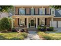 Welcoming front porch with decorative benches and well-maintained landscaping at 1401 Marshall Farm St, Wake Forest, NC 27587