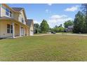 Well-kept lawn with mature landscaping and tree-lined street enhance this homes appeal at 1605 Sassafras St, Durham, NC 27712