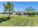 Inviting single-Gathering home with a spacious lawn, mature trees, and a well-maintained exterior at 187 Old Johnson Rd, Wendell, NC 27591