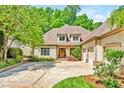 Traditional home with a three-car garage and a well-manicured lawn at 20011 Bragg, Chapel Hill, NC 27517