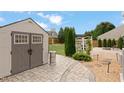 Beautifully landscaped backyard with storage shed, outdoor heater, and a cozy fire pit area at 203 Green Pasture Rd, Mebane, NC 27302