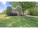 Charming home with a large front yard, mature tree, and a two car garage at 210 Mediate Dr, Raleigh, NC 27603
