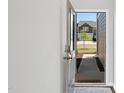 Front view of the townhome from the partially opened front door at 212 Brook Farm Ln, Fuquay Varina, NC 27526